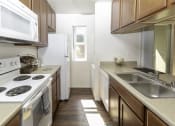 Thumbnail 3 of 28 - Fully Equipped Kitchen at Eucalyptus Grove Apartments, Chula Vista, California
